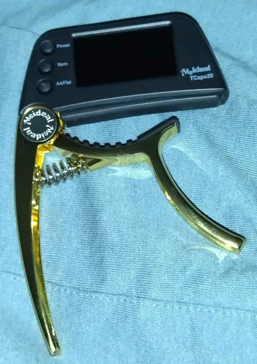 2-in-1 Guitar Capo Tuner with LED Display for All Instruments photo review