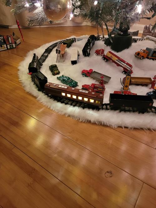 Train Toys with Luxury Tracks and Glowing Passenger, Christmas Train Sets for Around The Tree with Smokes, Lights & Sound photo review